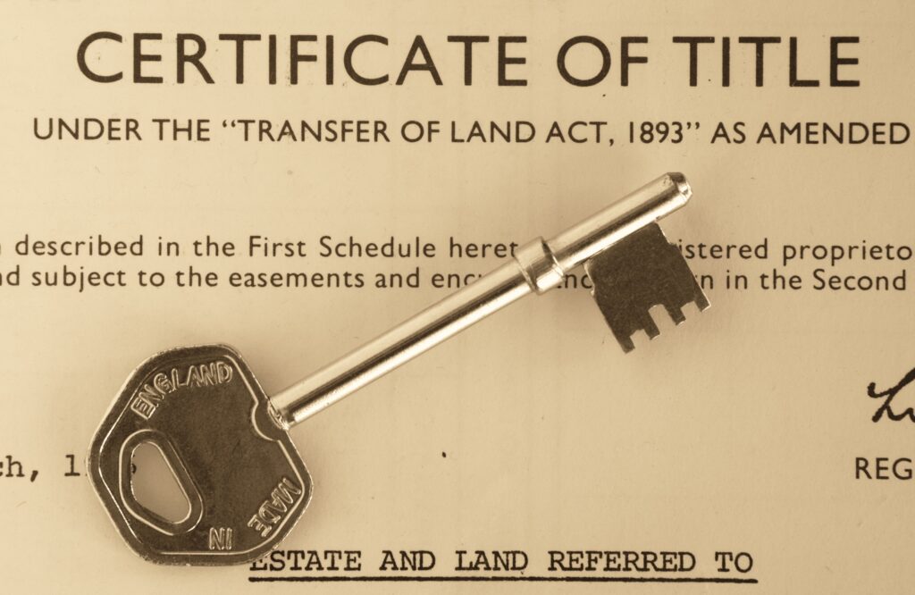 title deeds with a key on top