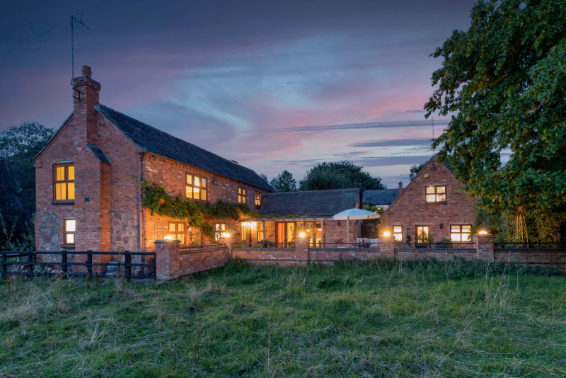 house lit up at night, estate agent photography by House and Home Bespoke